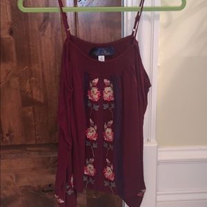 Red blouse with flowered designs